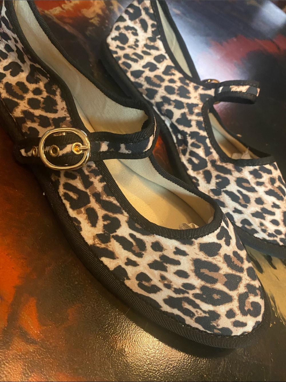 Soda leopard print Mary Jane flats with an adjustable strap and gold-tone buckle